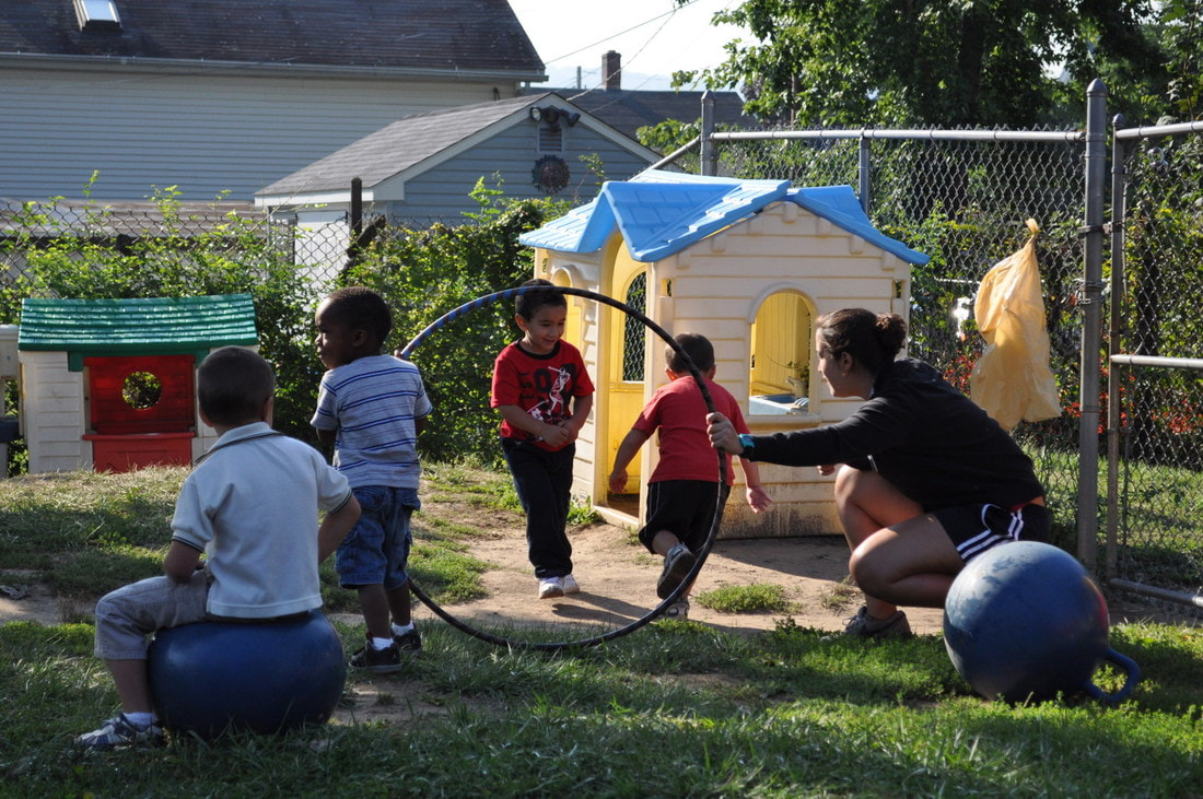 Image adult and children participating in active play